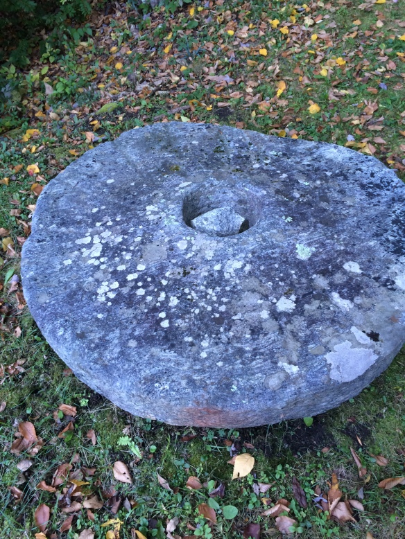 An old grindstone can be seen along the roadside, certainly pre-dating the CCC.
